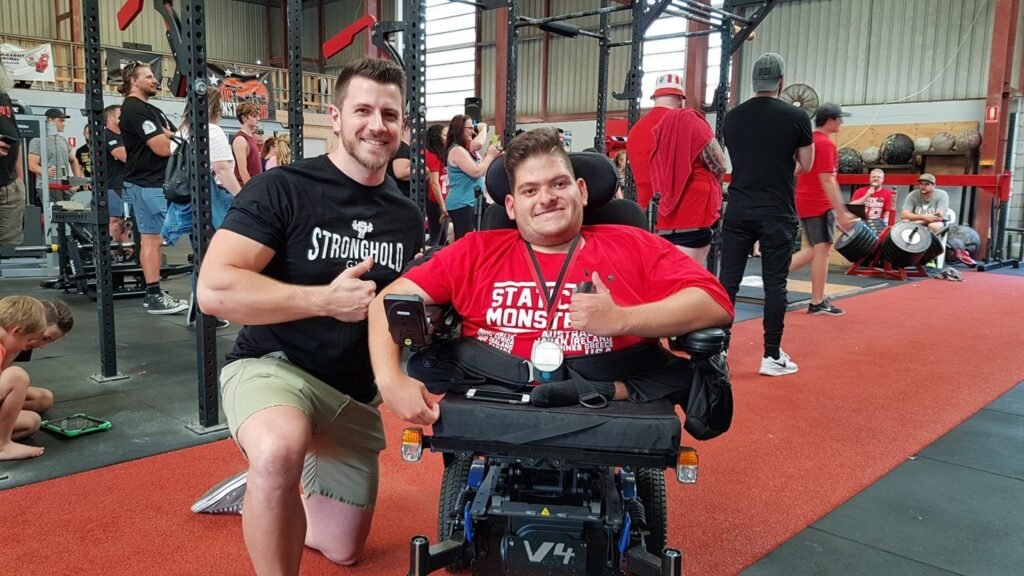David with Stronghold Gym members at a strength event