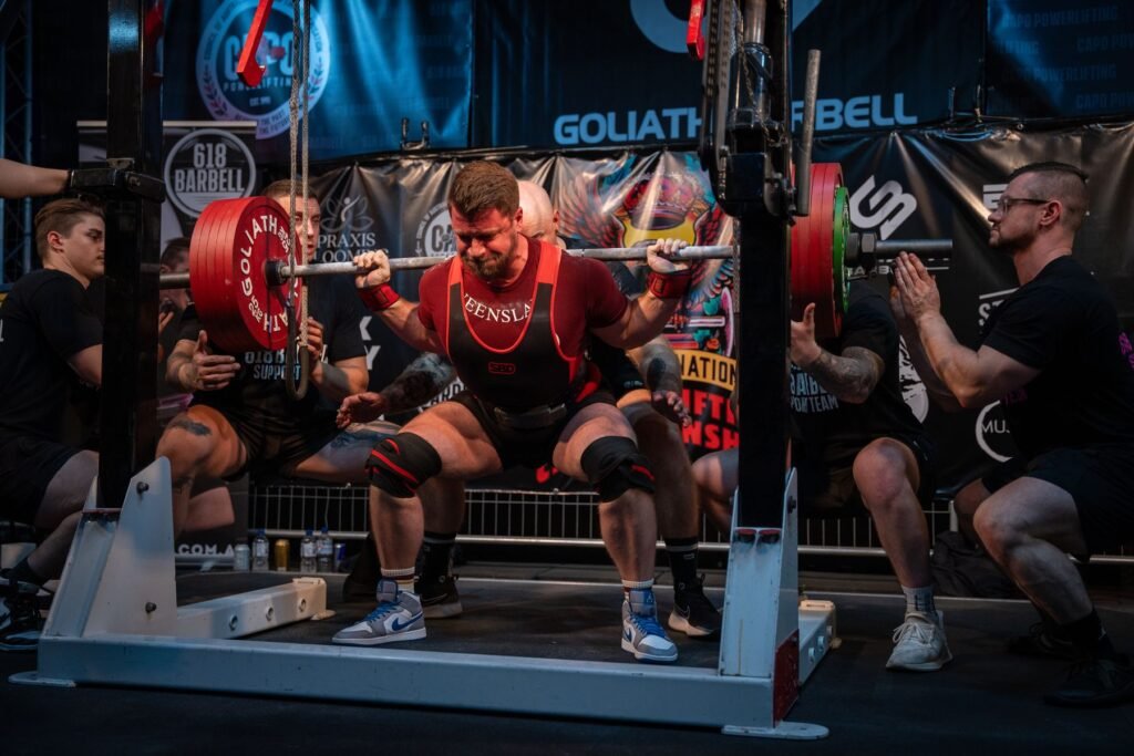 David Stanton squatting a heavy barbell at a Queensland powerlifting meet